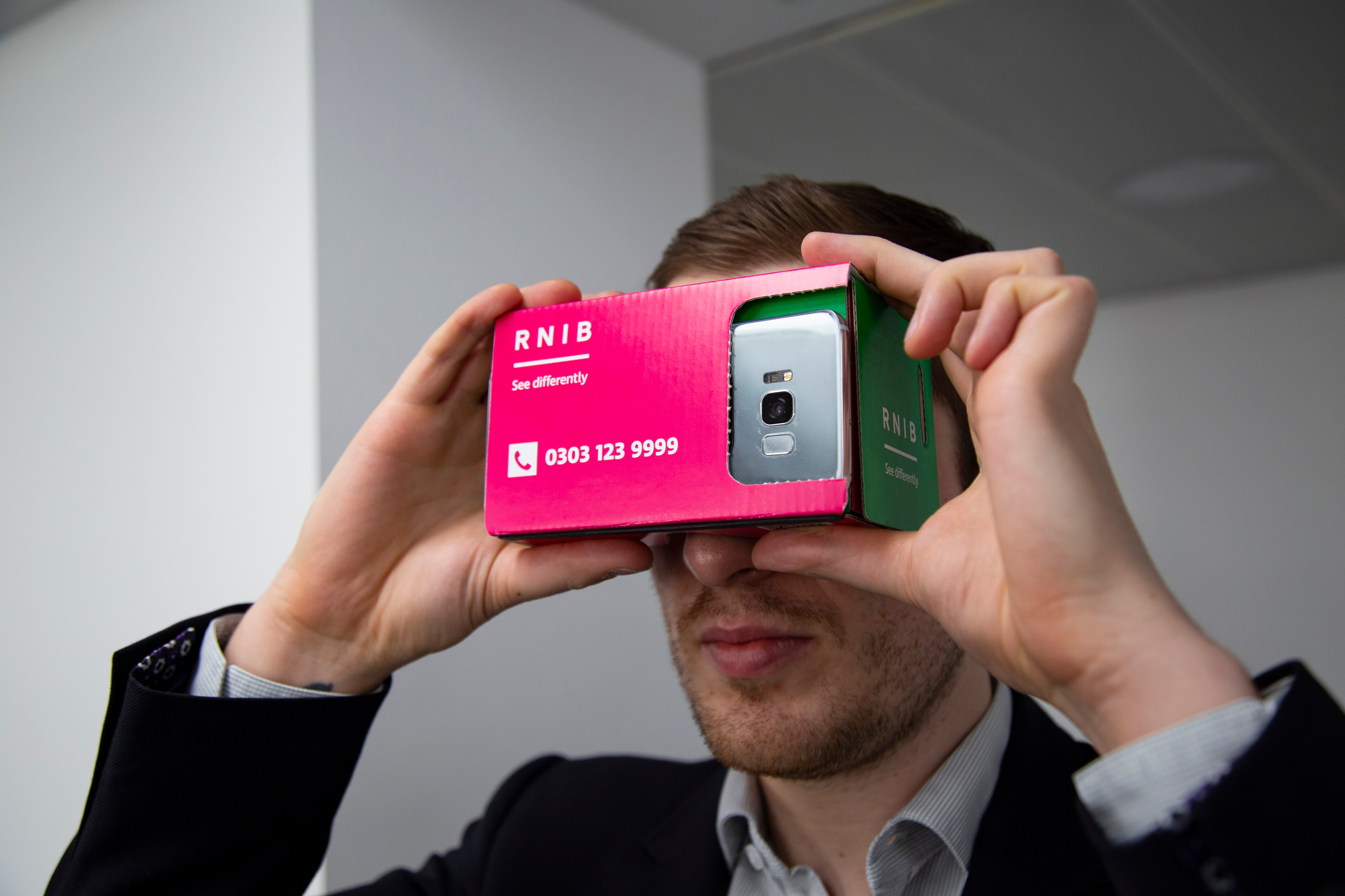 photo of man using the RNIB Mixed Reality Headset